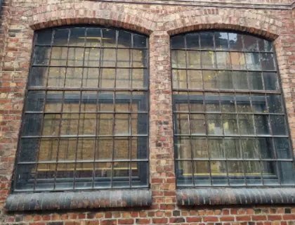Black framed window inside single glass 