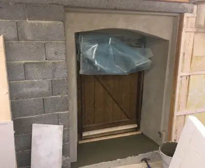 The added wall on the right in the picture is single-brick and was insulated in a conventional way. 